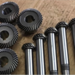 Bevel gear premature failure analysis showing pitting, vibration, and misalignment systemic issues